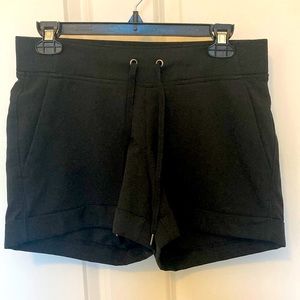 Athleta black cuffed shorts with drawstring. Size 4, ~3.75” inseam.